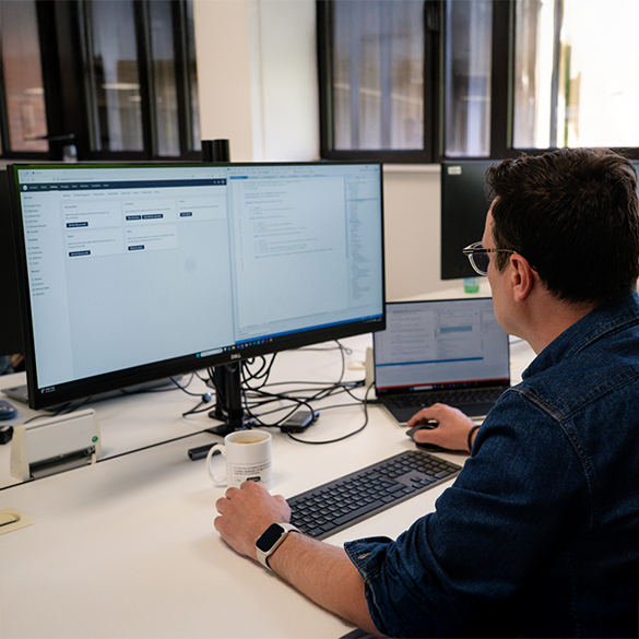 An over the shoulder shot of someone working on an Umbraco website on a computer monitor.