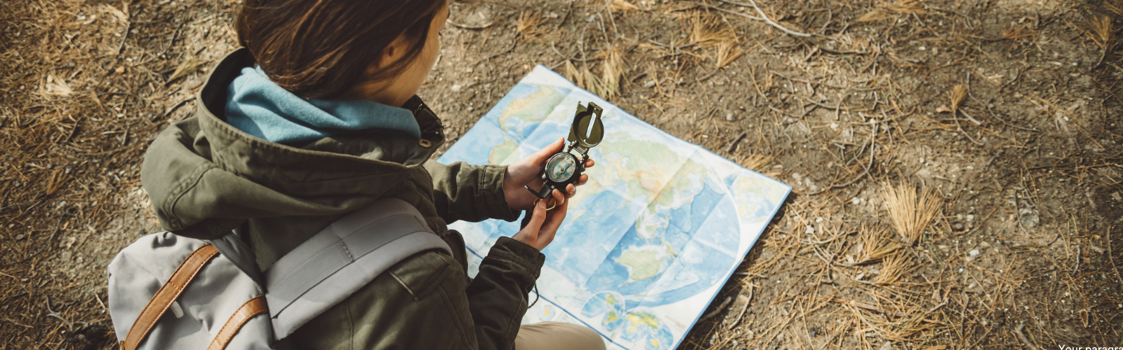 woman with map and compass travelling