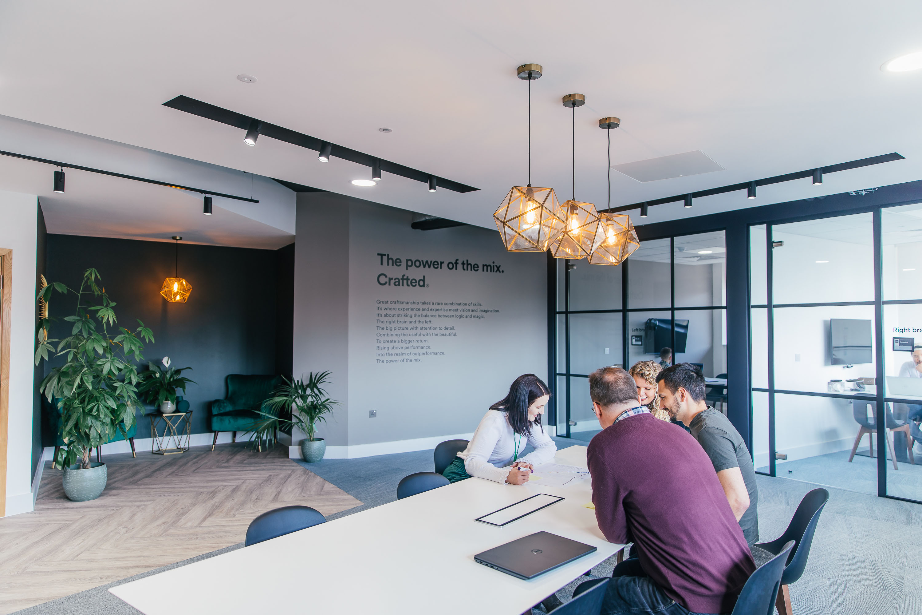 office entrance team working around a table