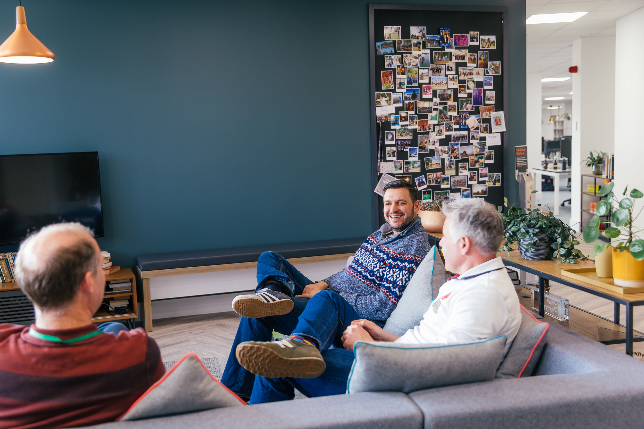 A group of people sitting on a sofa