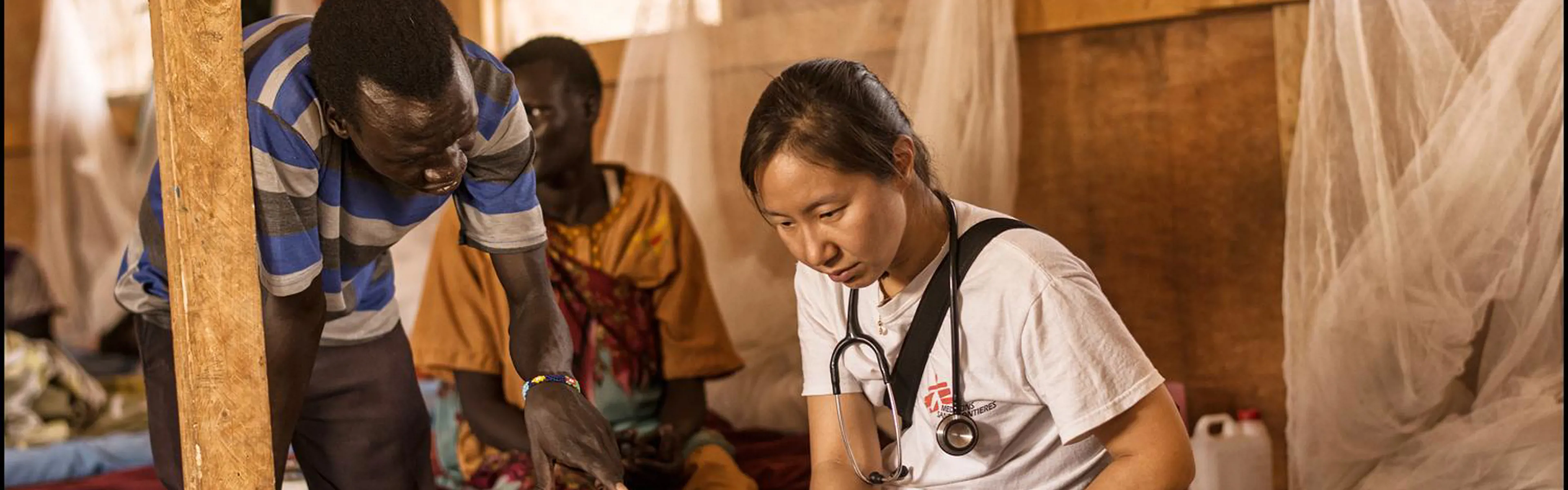 An MSF team taking a patient to an airlift