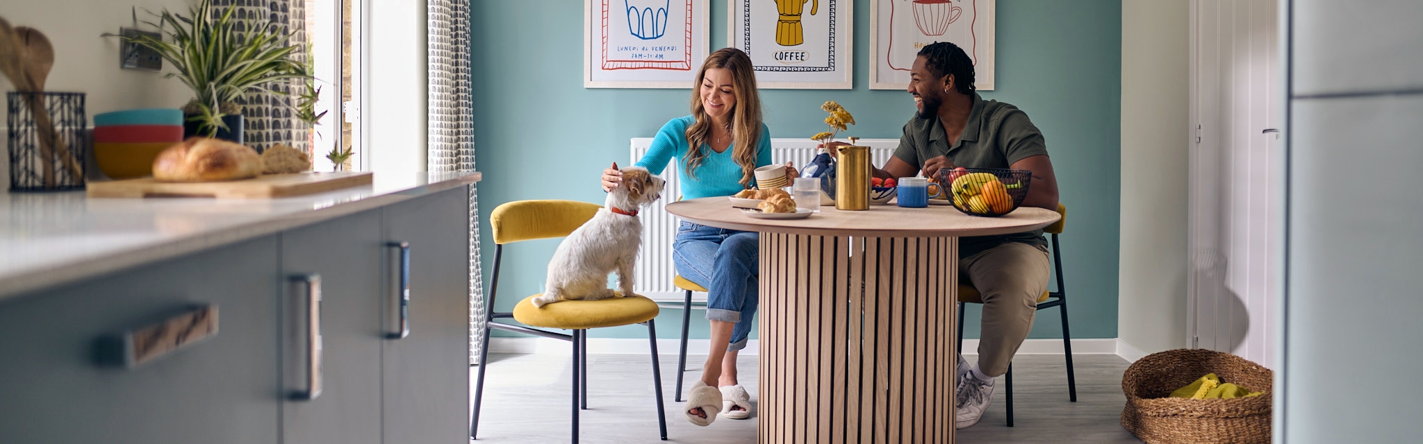 A kitchen scene with a couple having breakfast